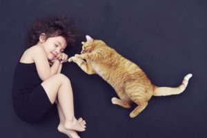 cat and girl sleeping together - why cats sleep all day long